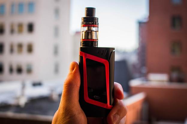A person holding a vape device