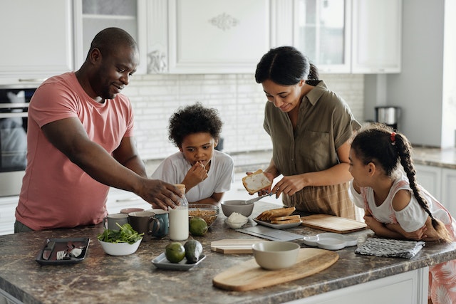 a-family-preparing-food-together-at-a-kitchen counter